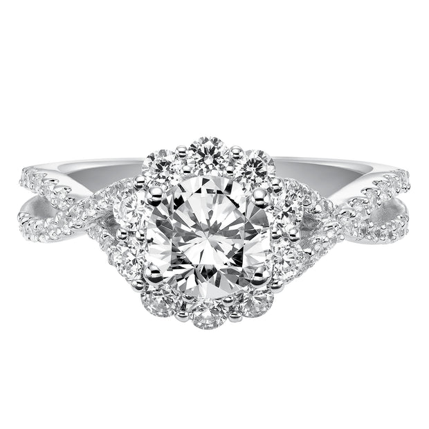 Awe-inspiring sparkle illuminates from this engagement ring featuring a shared prong set diamond halo and elegant twisted diamond band for grand effect.