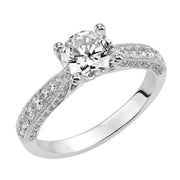 Milgrain detailing accents the diamond prong set band of this magnificent engagement ring