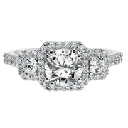 3-stone diamond engagement ring features prong set diamond halos surrounding each diamond whilst paired with a matching diamond band