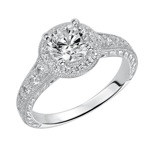 This show-stopping engagement ring is sure to impress with its diamond prong set halo and band with milgrain and engraving