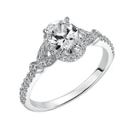 This romantic and beautiful engagement ring features an oval cut diamond accentuated by a prong set diamond halo and petal-inspired band design