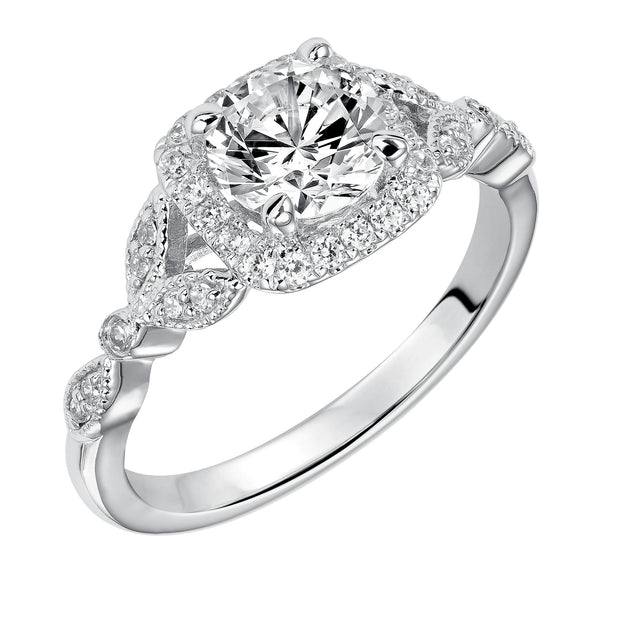 This whimsically styled engagement ring sparkles with its filigree and diamond halo and diamond prong set floral-inspired band
