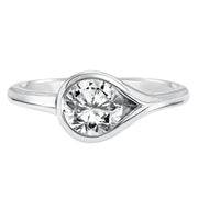 Chic and modern, this engagement ring is set beautifully in a high polished bezel set and bypass designed band