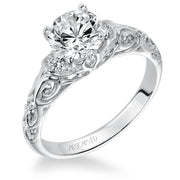 Diamond engagement ring with round center stone and carved diamond enhanced band